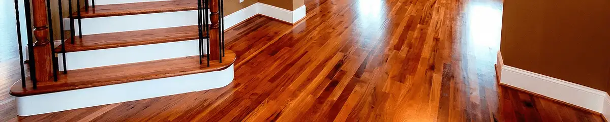Base floor of a staircase with professionally restored wood flooring in Minneapolis MN