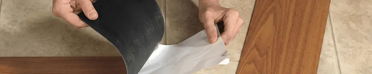 A professional installing vinyl flooring in Minneapolis, MN