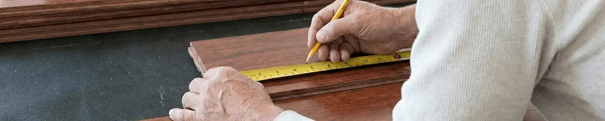 A professional installing wood flooring in Minneapolis, MN
